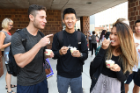 From left: Senior accounting majors Brennan Shoykhet, Patrick Wong and Jia Wu take an ice cream break. "True to the Blue" is "amazing," says Wu, between spoonfuls.