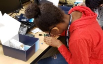 Student assembles a Raspberry Pi computer in GenCyber camp. Read about startups in this issue of Buffalo Business. 