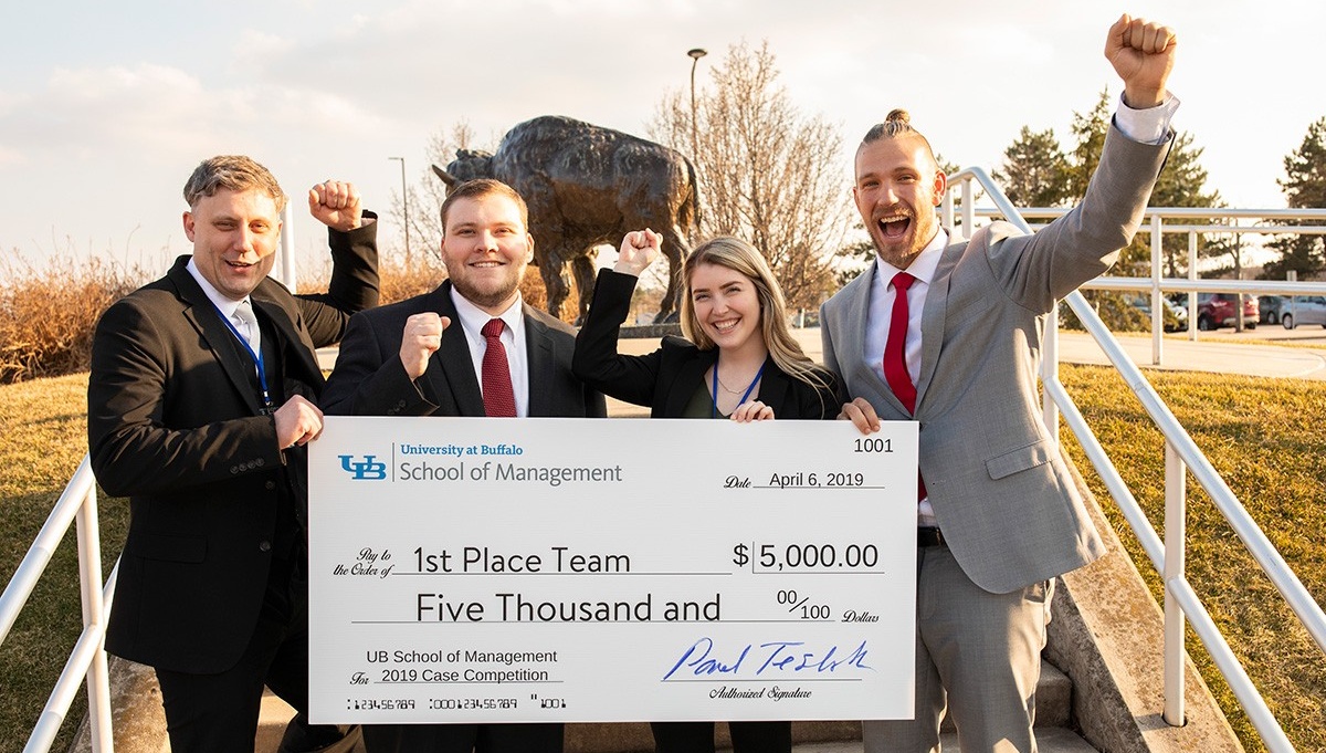 Zoom image: UB MBA Case Competition winners Orion LaMontagne, Mike Kleinfelder, Valerie Cardillo and Jacob Walsh. Photos: Tom Wolf 