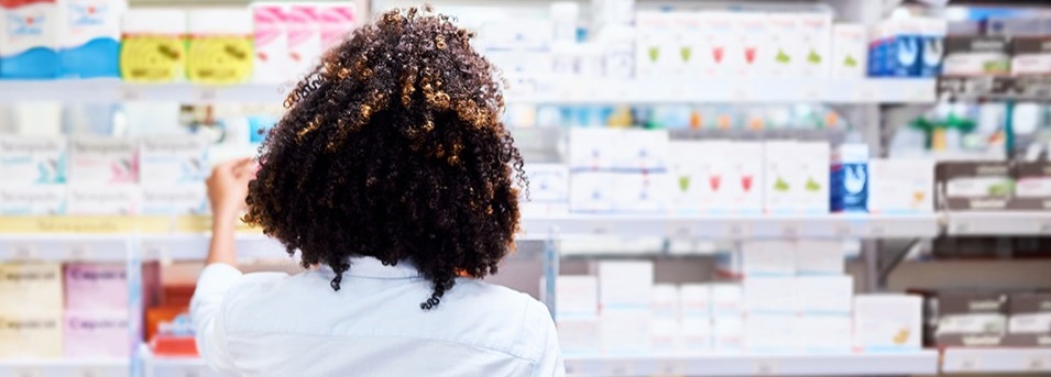A woman shopping at a pharmacy. 